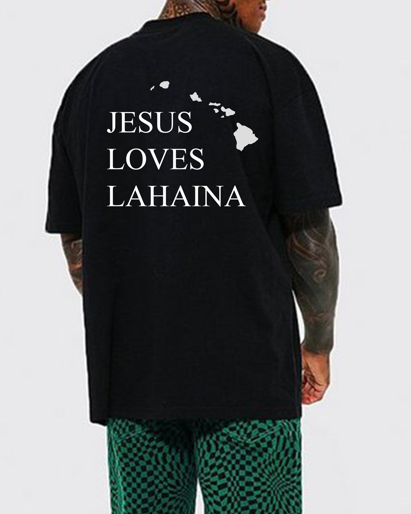 JESUS LOVES LAHAINA TEE - Front side: Not in the wind, not in the fire, but a still small voice - 1 Kings 19:11-12 | Support the victims from the 2023 Lahaina Fire with a Jesus Loves Lahaina T-shirt | Black tee with white screen print