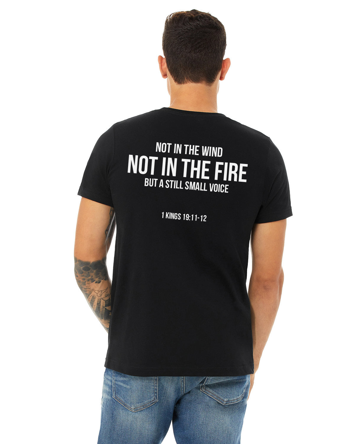 JESUS STILL LOVES LAHAINA TEE - Backside: Not in the wind, not in the fire, but a still small voice - 1 Kings 19:11-12 | Support the victims from the 2023 Lahaina Fire with a Jesus Still Loves Lahaina T-shirt | Black tee with white screen print